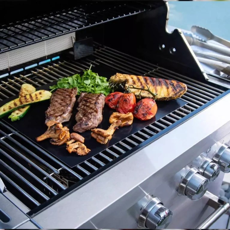PTFE-coated fiberglass grill mats with cooked vegetables on barbecue, showing non-stick performance and easy food release