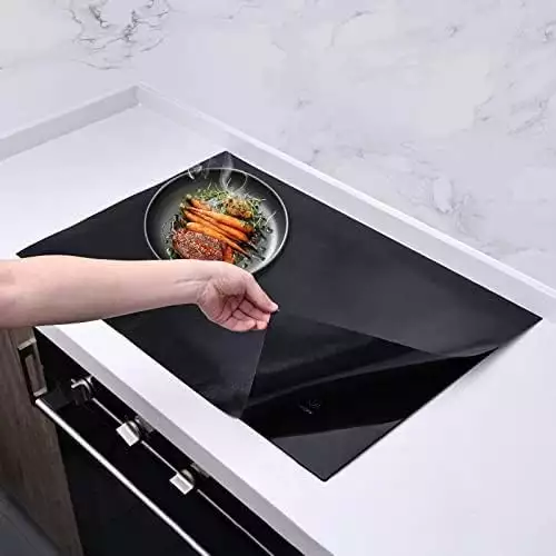 Custom cut to fit silicone stove top protector liner for magnetic induction hobs.