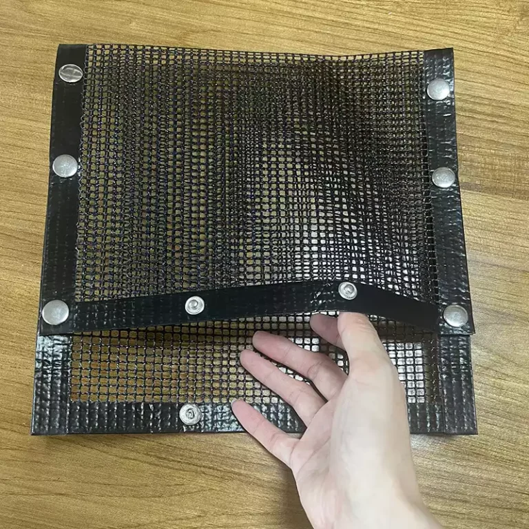 A close-up view of the wide opening of a detachable Flat-Lay Mesh Grill Bag with heavy-duty fasteners along the edges.