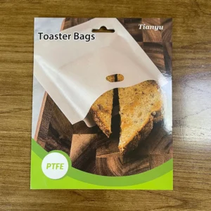 Premium food-grade PTFE toaster bags in custom retail card packaging with hanging hole, manufactured by Tianyu Synthetic for private label kitchenware brands.