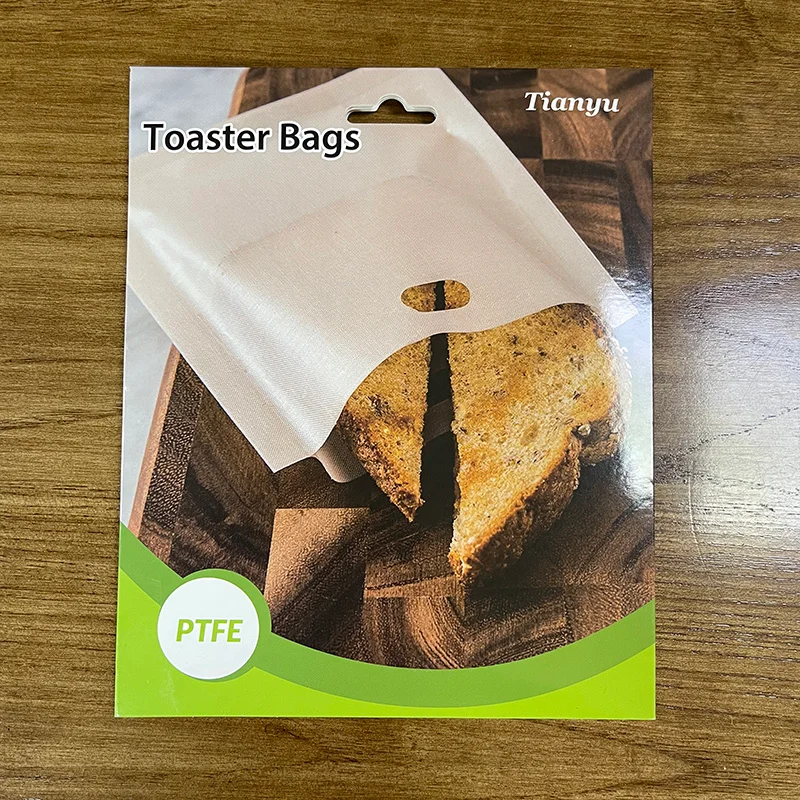 Premium food-grade PTFE toaster bags in custom retail card packaging with hanging hole, manufactured by Tianyu Synthetic for private label kitchenware brands.