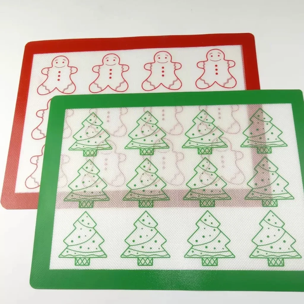 Food-grade silicone coated fiberglass custom mats with holiday prints, manufactured directly by Tianyu Synthetic for retail branding.